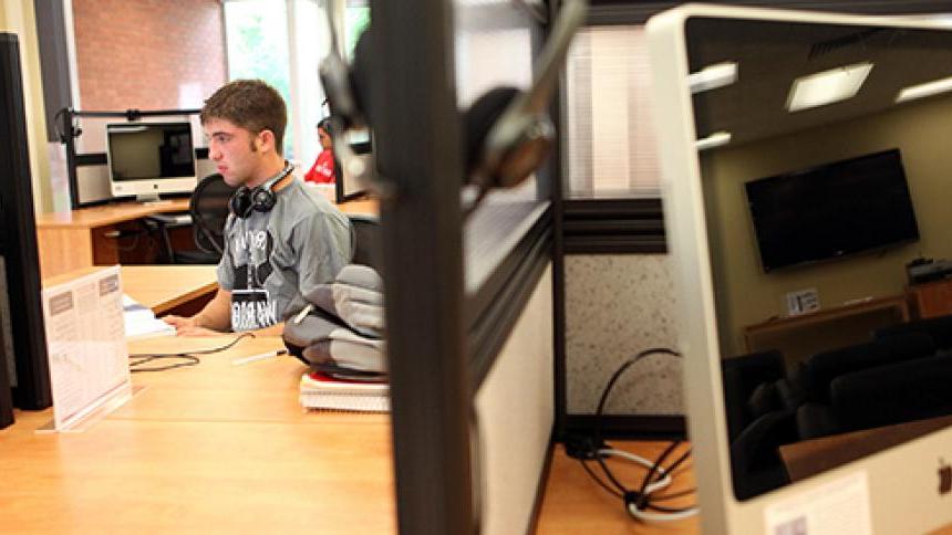 student sitting at a CLIC computer